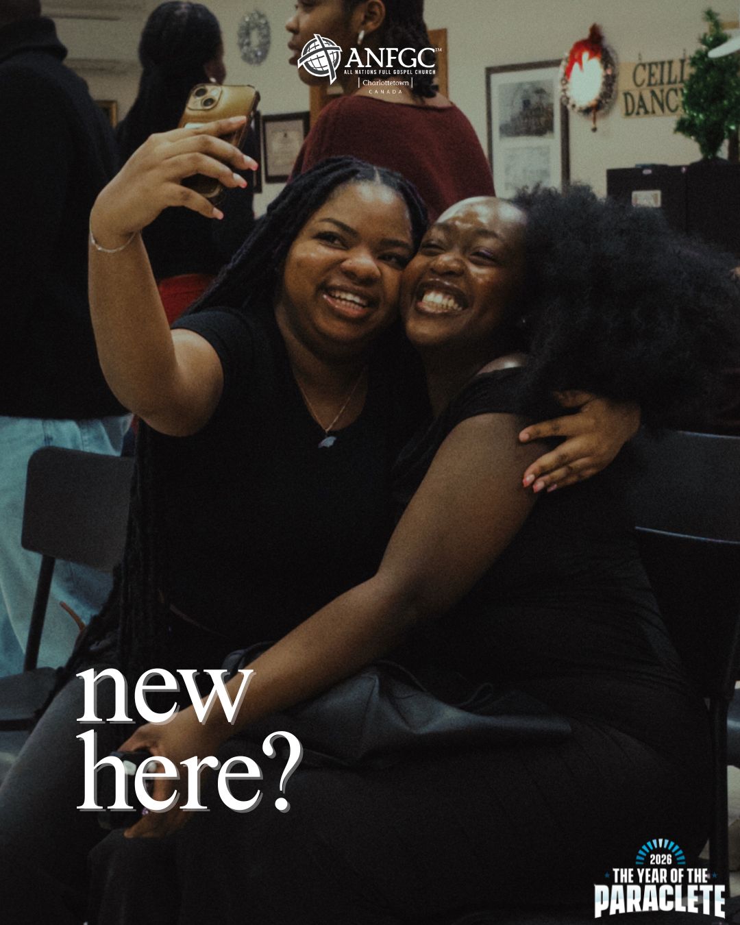 Two women laughing while taking a selfie at church — new here?